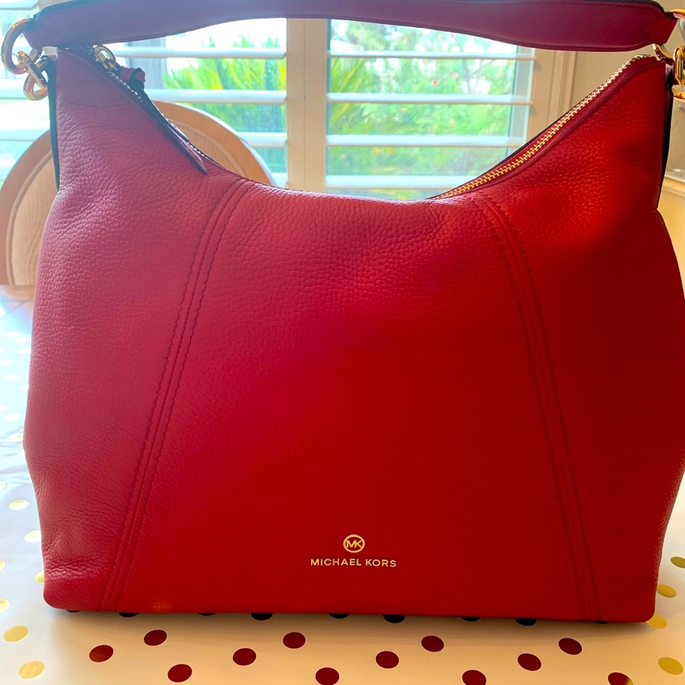 Micheal Kors large Red Bag with gold trim.